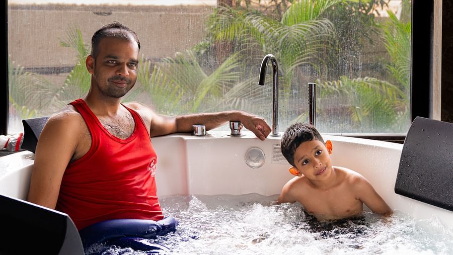 A father and son enjoying a relaxing moment in the jacuzzi at Crescent Spa & Resort, Indore