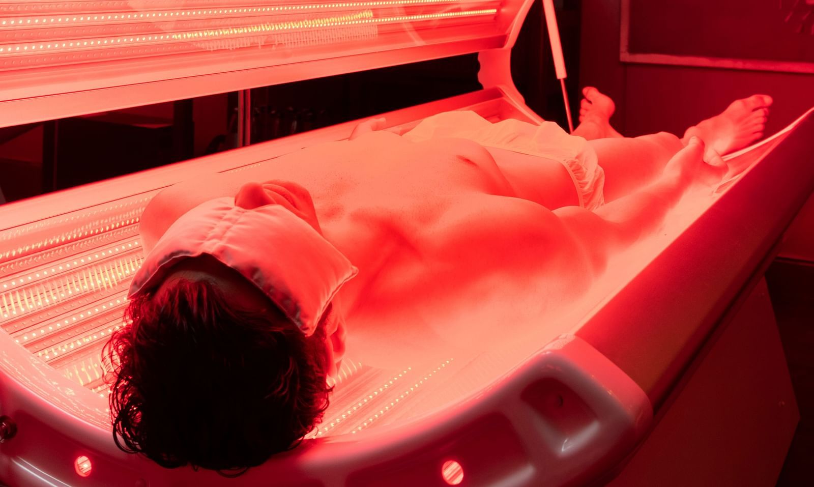 An image of a person enjoying red light therapy at our spa in New Delhi - Claridges Collection