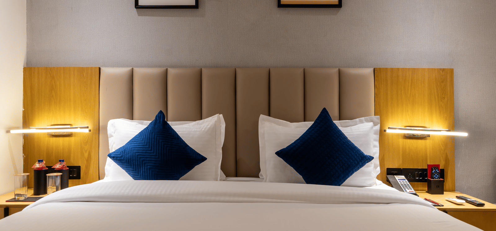 Comfortable accommodation with plush bedding and warm lighting at Lords Studio Inn, Jamnagar.