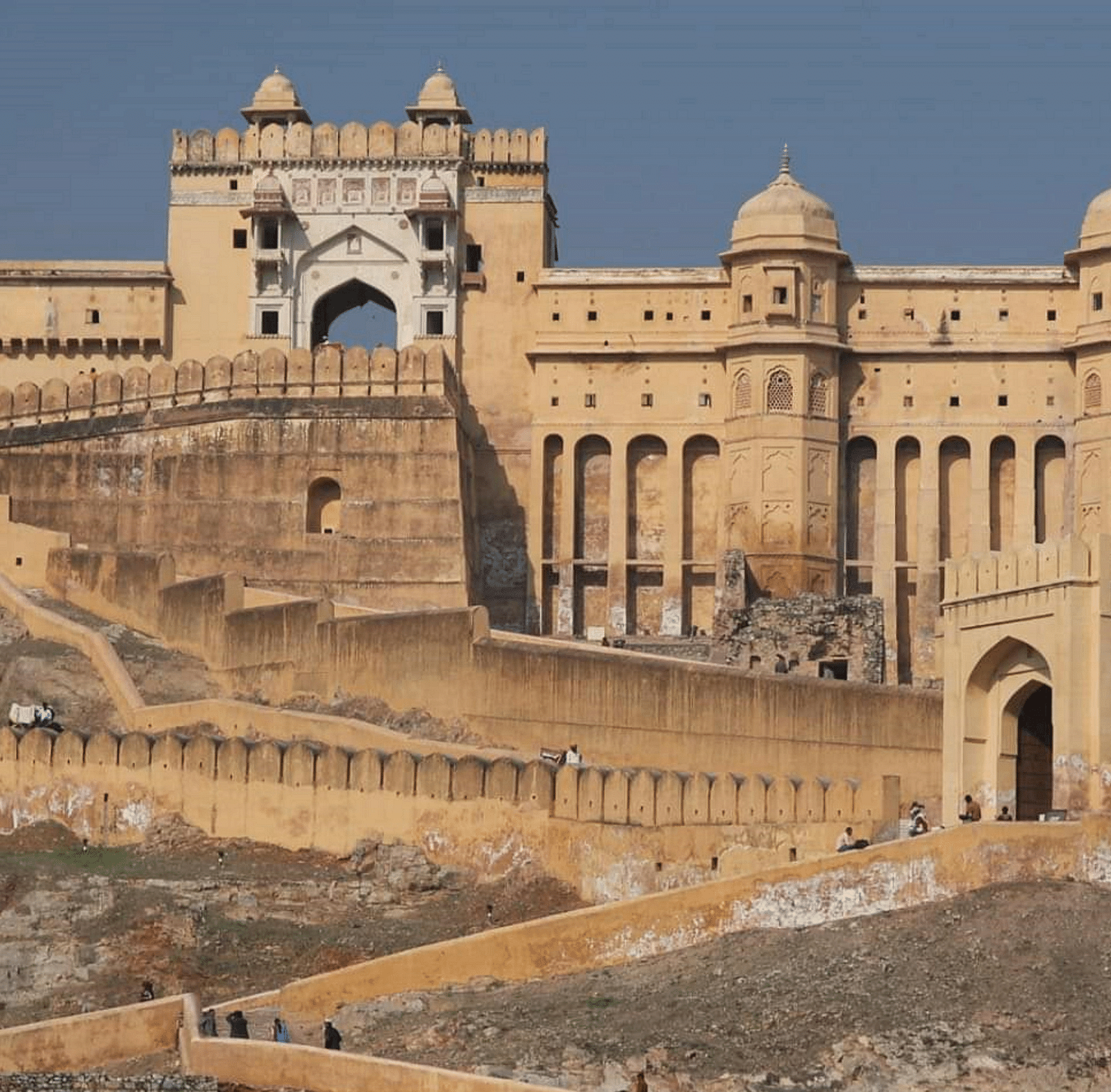 facade image of the Amer Fort in jaipur at a certain height shining bright with the sunlight