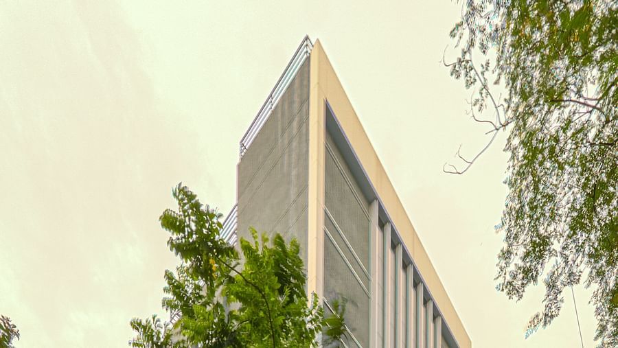 Facade image of Nexstar Suites in pune with trees next to it