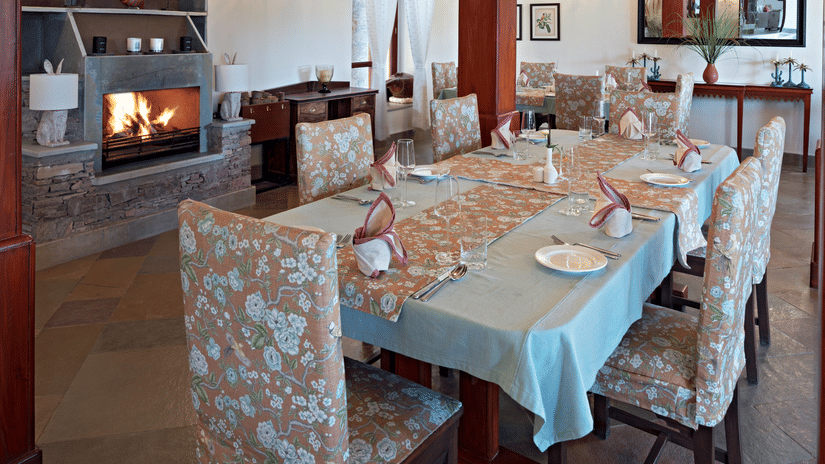 Seating arrangements inside the Restaurant and a chandelier on the ceiling - Chunda Shikar Oudi