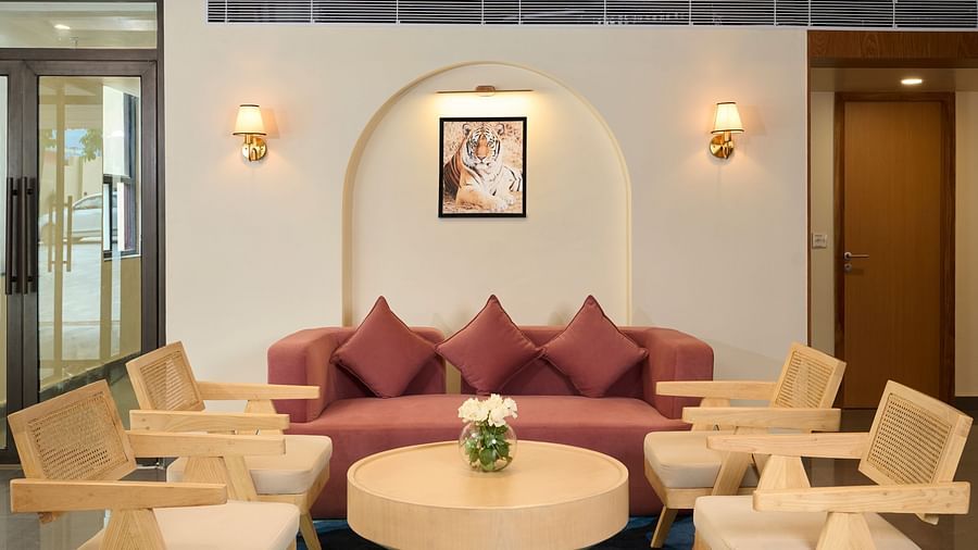 chairs and a coffee table in the reception area at ABN Sarovar Portico, Jim Corbett