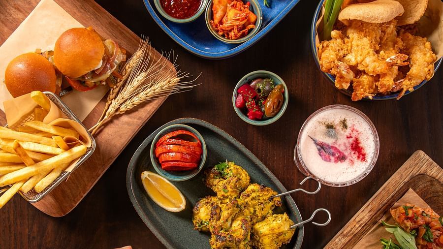Delectable spread of kebabs, fries, sliders, and dips served at The Dukes Retreat’s restaurant
