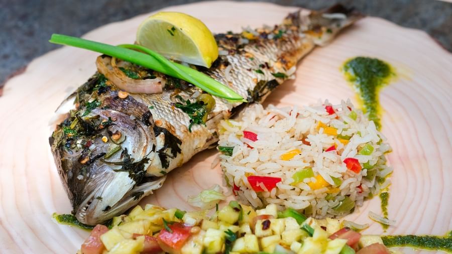A plate of roasted fish with pineapple salsa | Mango Hill, Pondicherry
