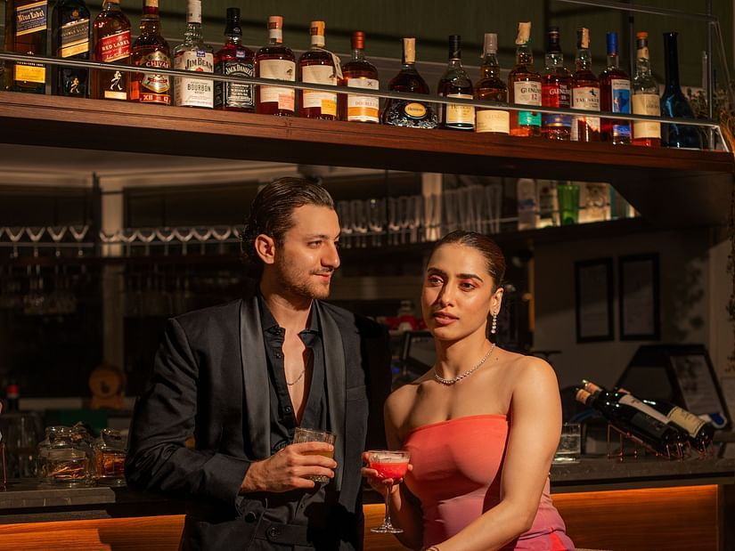Couple enjoying a romantic evening with drinks at the cosy bar at The Dukes Retreat