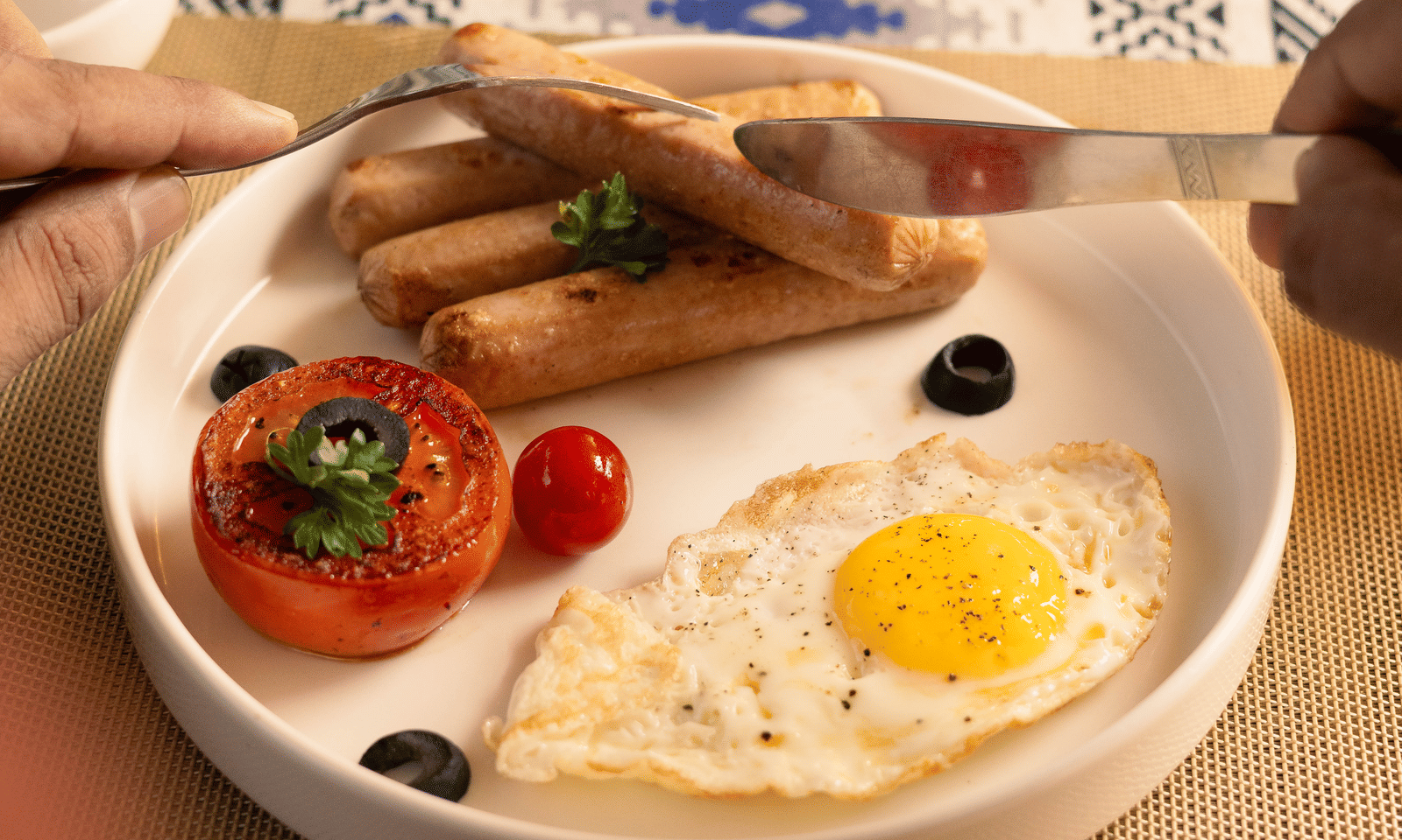 A breakfast plate with toast, sunny side up eggs, cherry tomatoes, and a hot beverage - Megha Resort & Villas, Dehradun