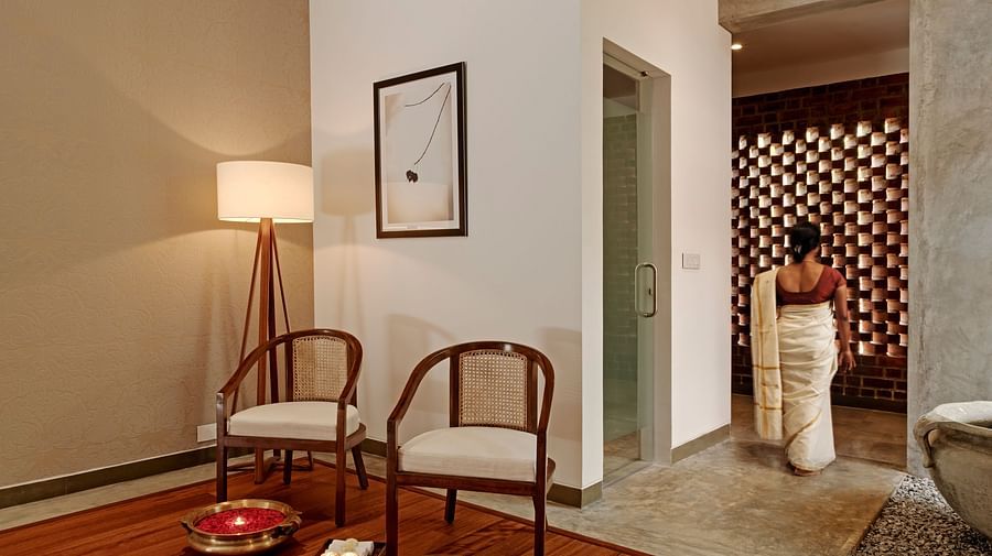 Interior room with two chairs, a lamp, and a rug, minimalist design - Shreyas Retreat