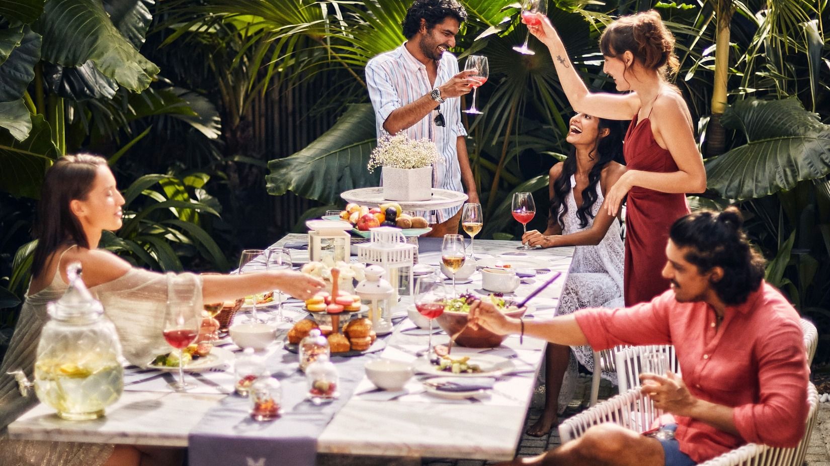People celebrating and eating at the luxury villa with chef in Goa - Villa in Palms by Vescapes