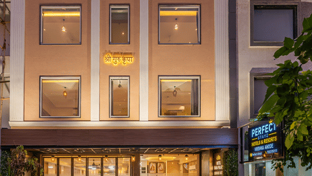 Building facade illuminated in the evening at Perfectstayz Premium Vrindavan.