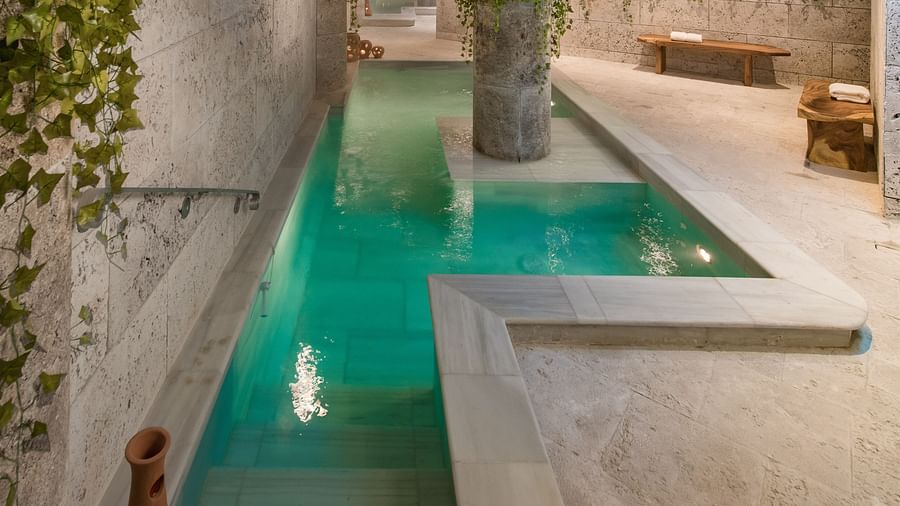 An image of Irie Spa in Montego Bay with a pool and ambient lighting - S Hotel Montego Bay, Jamaica