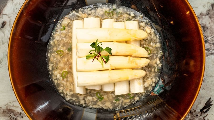 image of a ceramic bowl with soup served in it - The Claridges New Delhi
