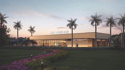 An overview of the The Pavilion during twilight with coconut trees in view - Karma Lakelands.