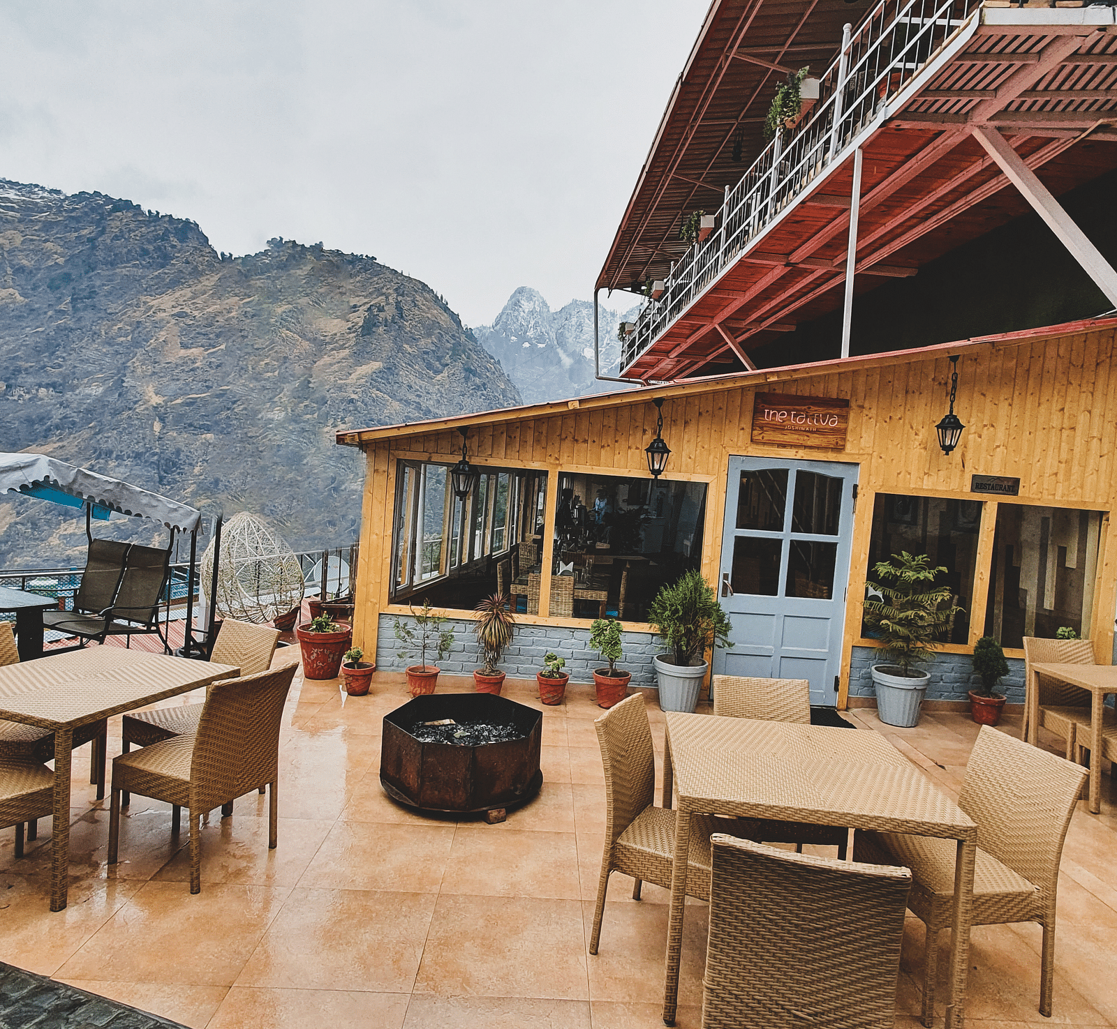 image featuring an open seating area with beautiful mountain views in the background - The Tattva, Joshimath