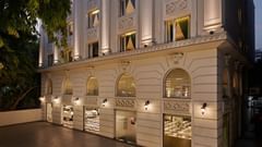 An image of the facade illuminated by ambient lighting - Deventure Sarovar Portico, Patel Nagar