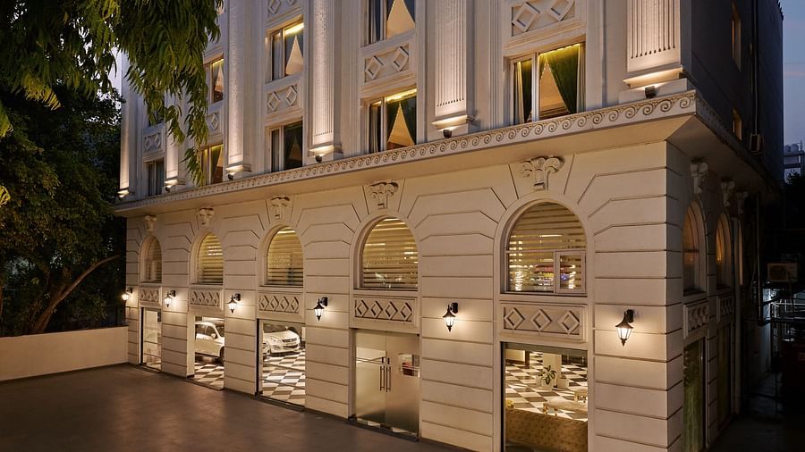 An image of the facade illuminated by ambient lighting - Deventure Sarovar Portico, Patel Nagar