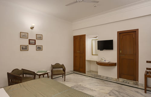 Deluxe Lake Facing Rooms sitting area at Ram Pratap Palace