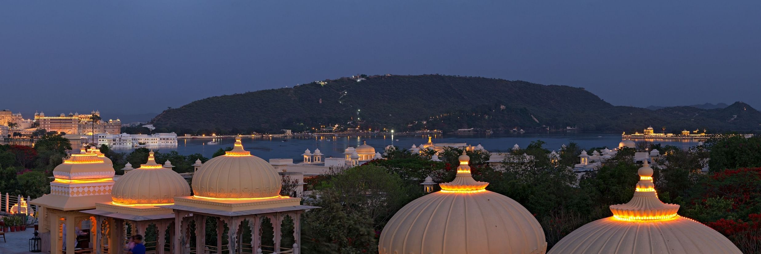 Panoramic image of the Terrace Lake View with a mountain in the background - Chunda Hotels