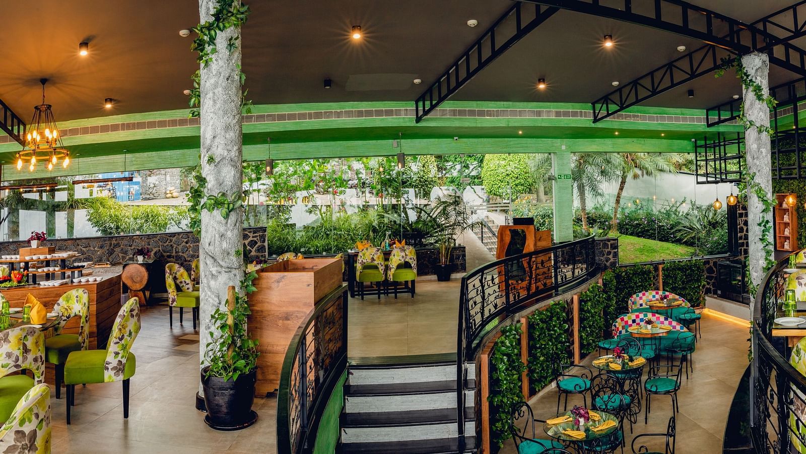An image of a restaurant with seating arrangement and decoration - Great Trails Yercaud by GRT Hotels
