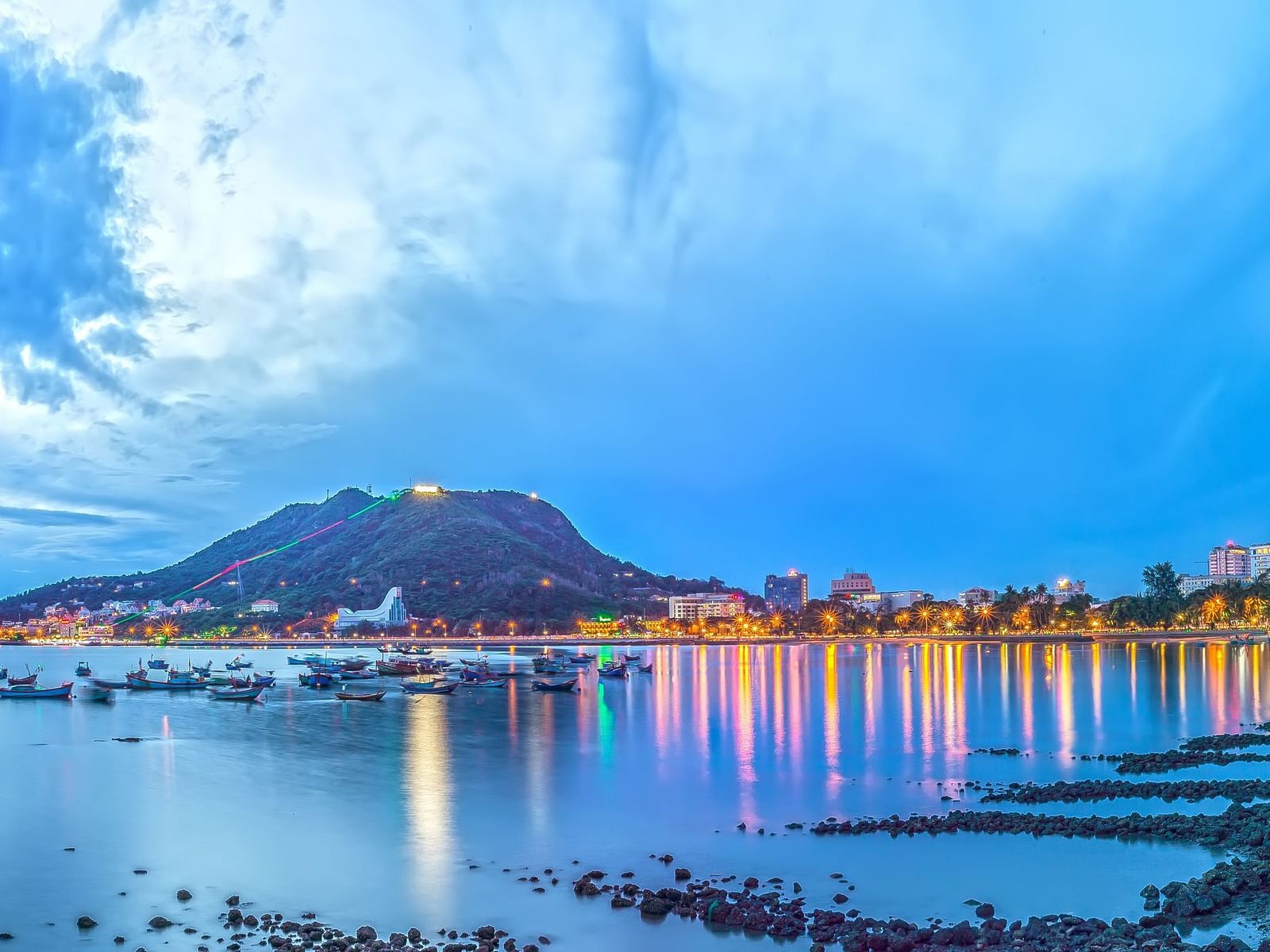 A panoramic view of Vung Tau province in Vietnam with a waterbody and land in view.