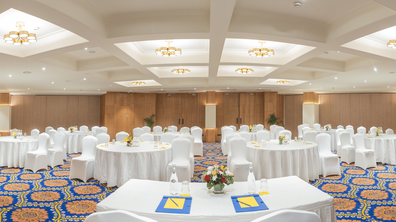 Rajputana Hall with cluster seating arrangement at Golden Tulip Jaipur City Center, featuring round tables and elegant banquet setup