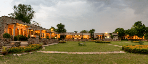 Deo Bagh - 17th Century, Gwalior - a panoramic view of Deo Bagh resort in Gwalior during evening time with the lights on on the buildings.