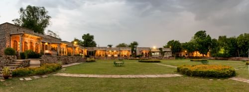 Deo Bagh - 17th Century, Gwalior - a panoramic view of Deo Bagh resort in Gwalior during evening time with the lights on on the buildings.