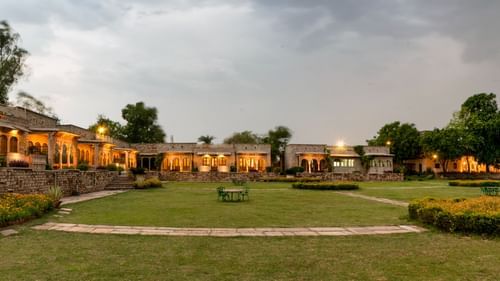 Deo Bagh - 17th Century, Gwalior - a panoramic view of Deo Bagh resort in Gwalior during evening time with the lights on on the buildings.