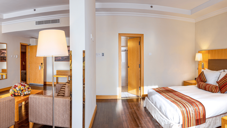 An overview of a room with the bedroom and the living room in view - Ramada by Wyndham Addis, Addis Ababa.