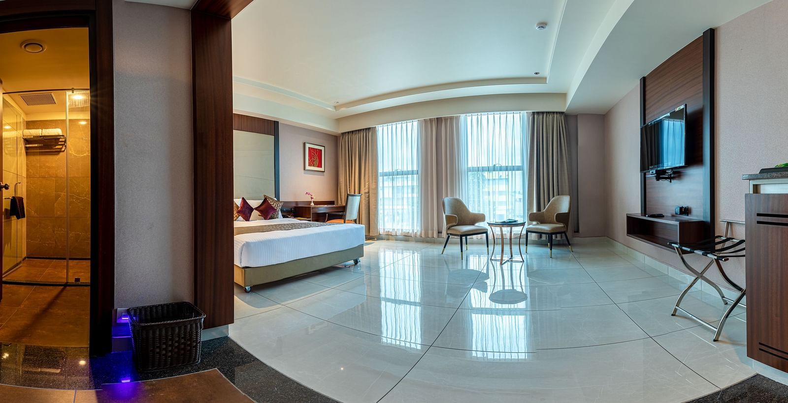 Panoramic view of a room featuring a bed and a sitting area at M Pro Palace.