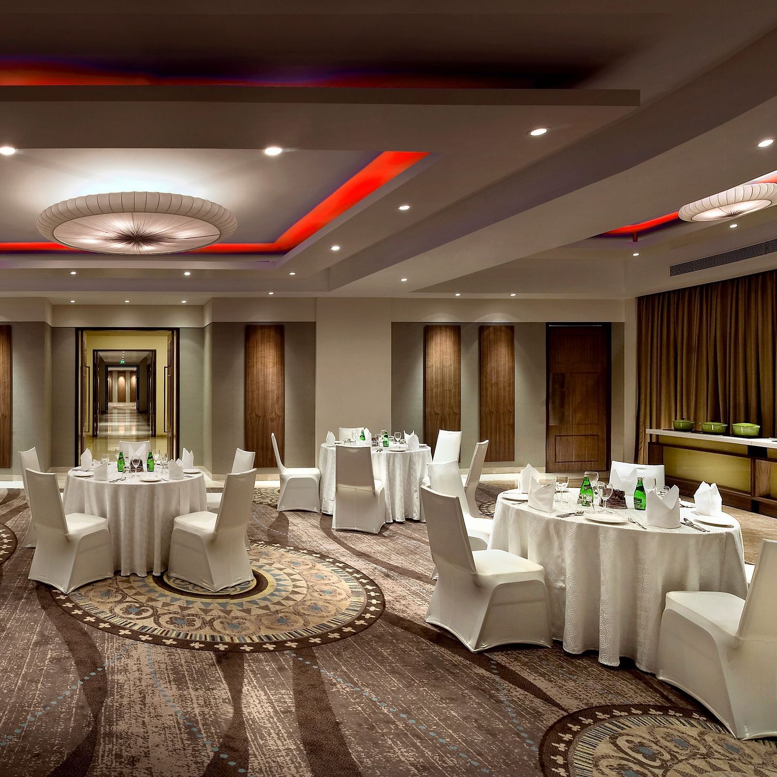 Elegantly decorated banquet hall with tables set for a formal event - The Raintree, St. Mary's Road.