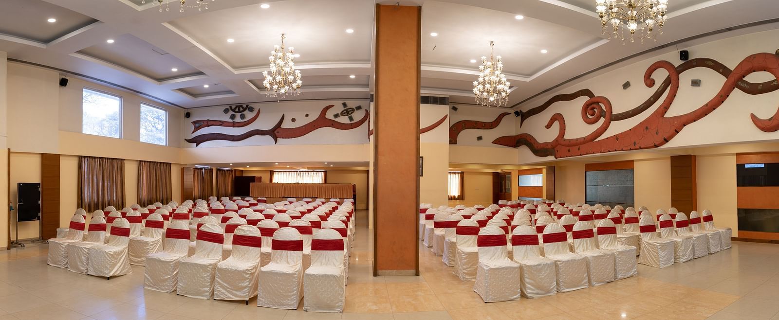 Theatre style seating arrangements inside the a banquet hall at Hotel Pai Vista, Mysore set up for an event