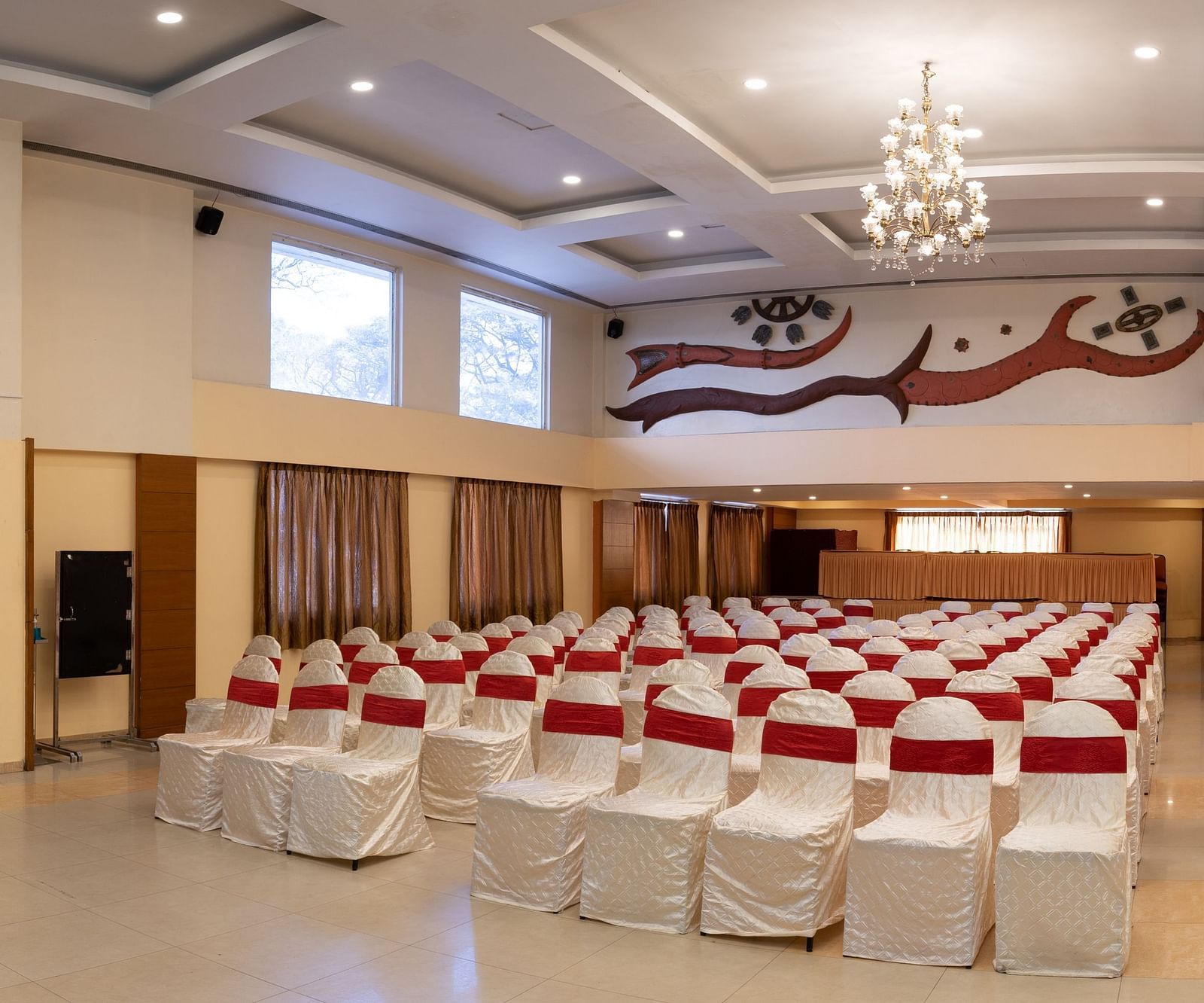 Theatre style seating arrangements inside the a banquet hall at Hotel Pai Vista, Mysore set up for an event