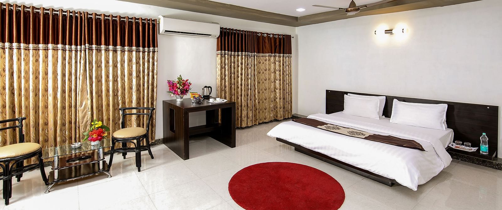A room with with a double bed and work desk at Saavaj Resort