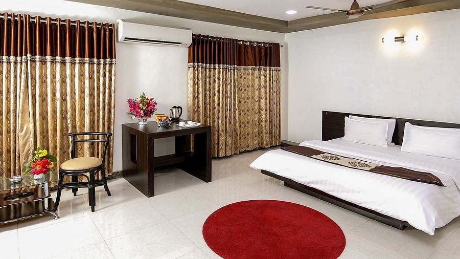 A room with with a double bed and work desk at Saavaj Resort