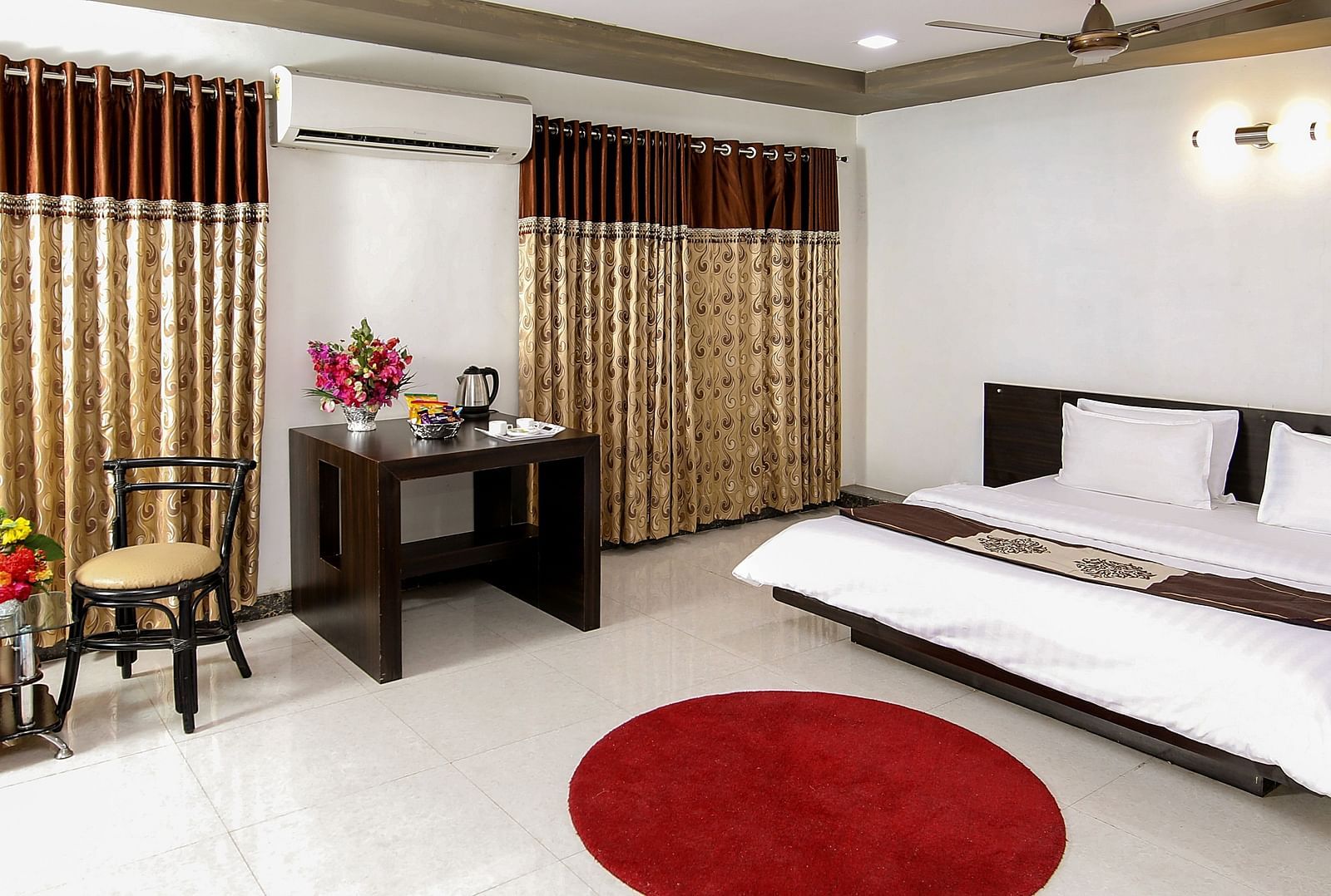 A room with with a double bed and work desk at Saavaj Resort