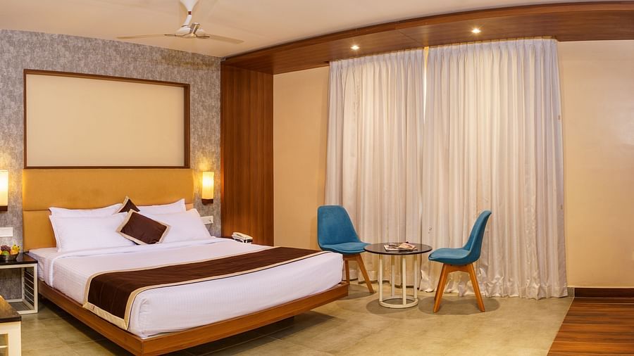 Spacious room with bed and sitting area at Wyt Hotels, Rameswaram