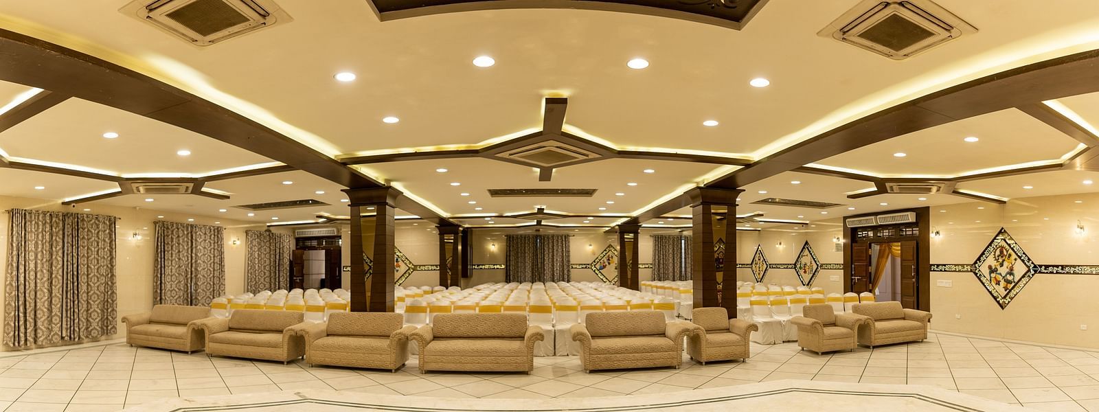 Seating arrangements inside a banquet hall - Hotel Pai Vista, KR Road