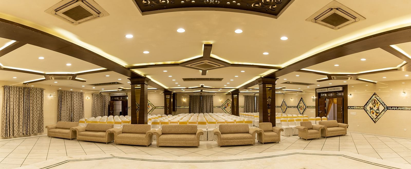 Seating arrangements inside a banquet hall - Hotel Pai Vista, KR Road