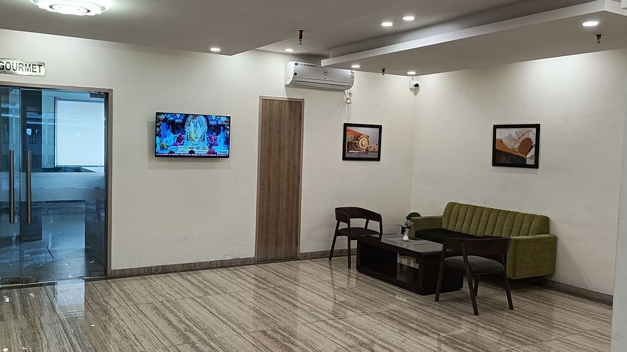 A sofa and a coffee table in the lobby section - Starlit Suites, Shirdi