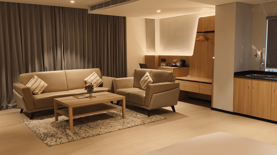 Spacious living area in the Suite Room at De Venetian by TGI, ideal for business and leisure travellers.