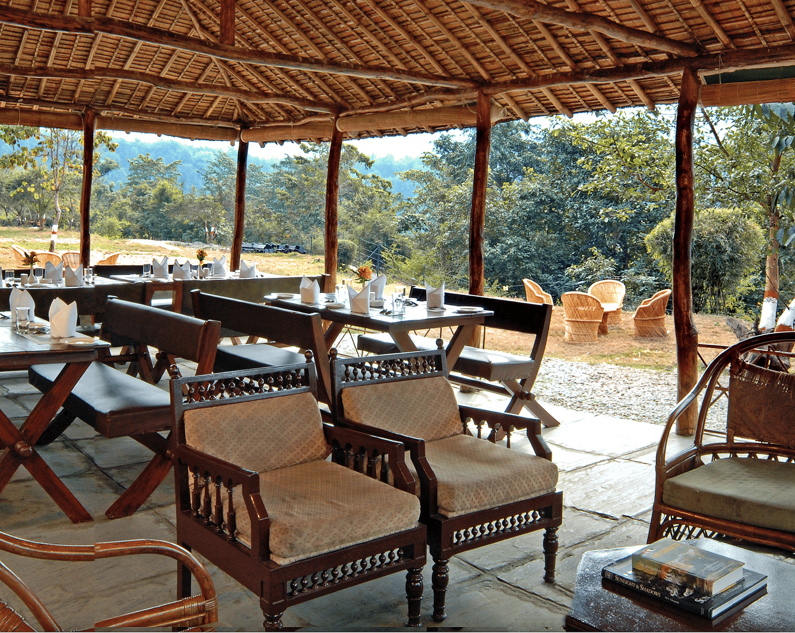 a restaurant with clusters of tables and chairs covered with a canopy - The Jamoon, Corbett