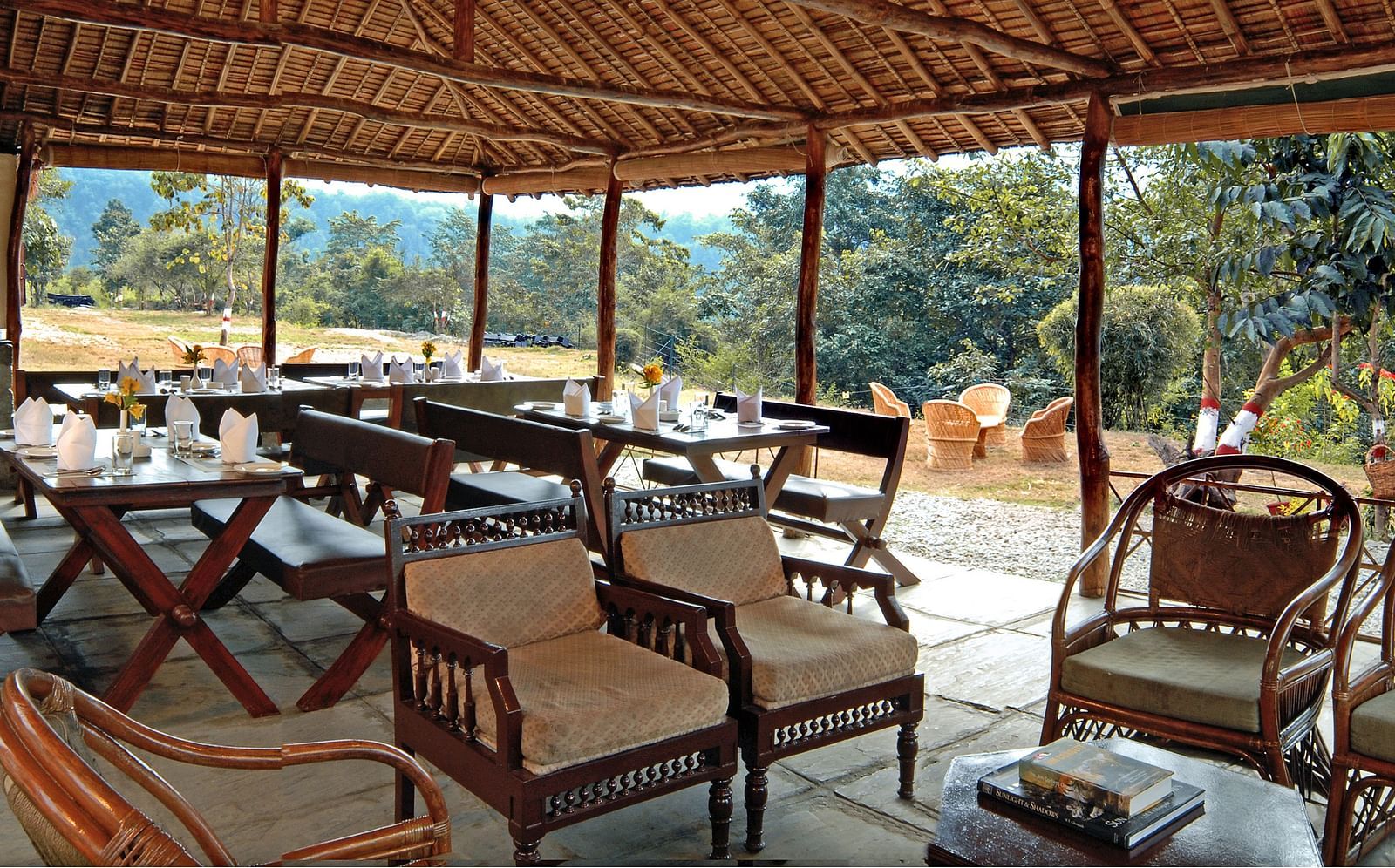 a restaurant with clusters of tables and chairs covered with a canopy - The Jamoon, Corbett