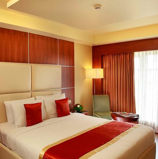 room with separate living area and king size bed