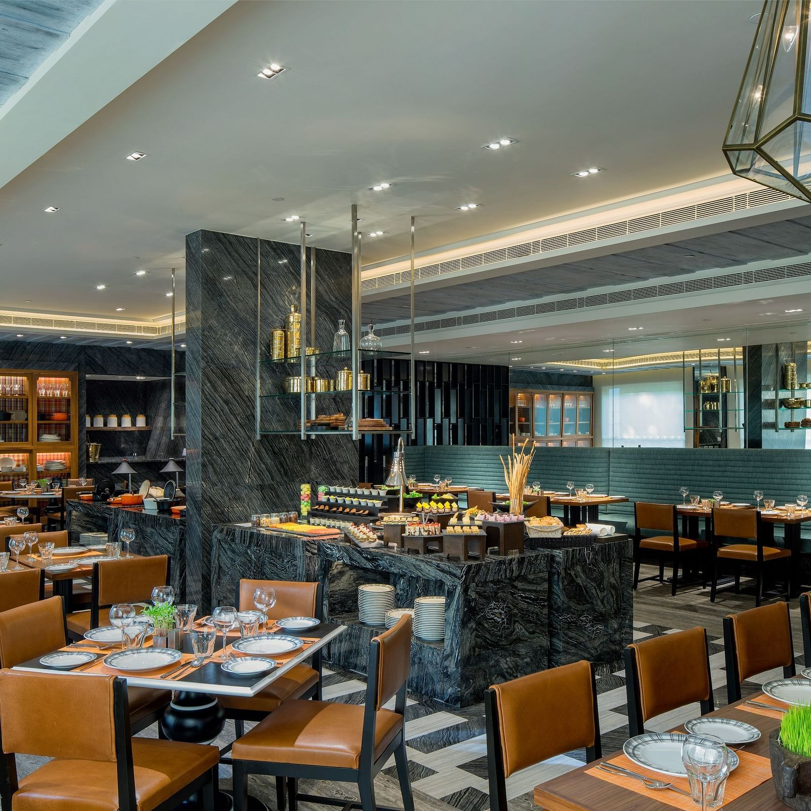 Image of a restaurant  at The Raintree St. Mary s Road with chairs and tables