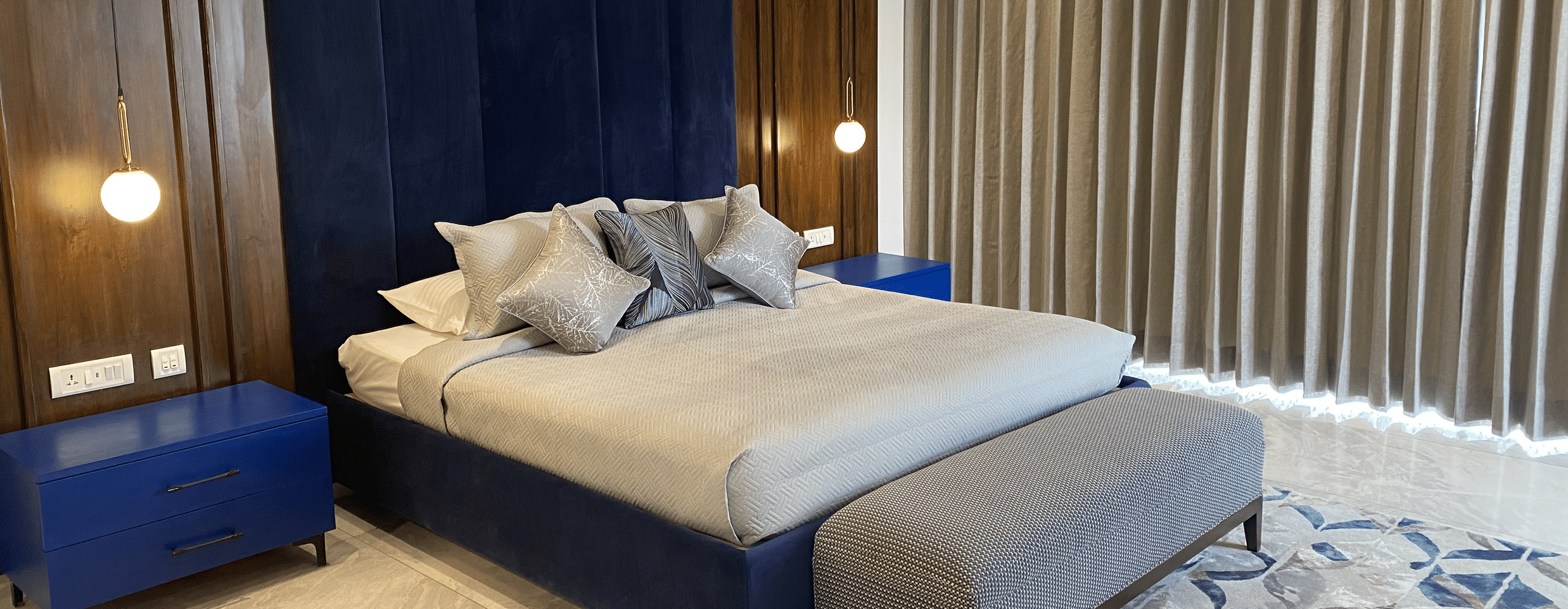 Hotel room interior with modern design and furniture.