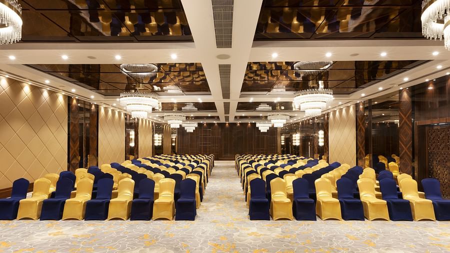 A front view of a banquet hall with chairs arranged on both sides and a pathway in between | Cenneys Gateway