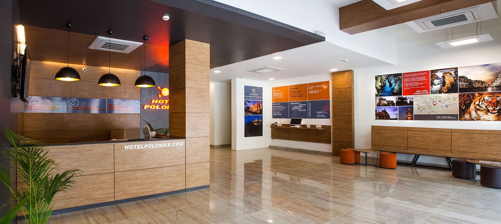 a spacious lobby area at our hotel featuring the reception desk - Max Hotel Jabalpur