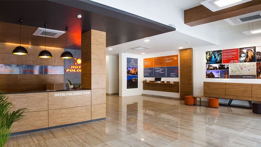a spacious lobby area at our hotel featuring the reception desk - Max Hotel Jabalpur