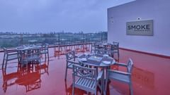 tables and chairs at Smoke BBQ love, our rooftop restaurant in Mahabalipuram